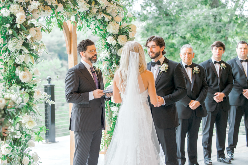 The bride and groom share their vows during their Southern wedding ceremony at Burns Bluff at High Falls.