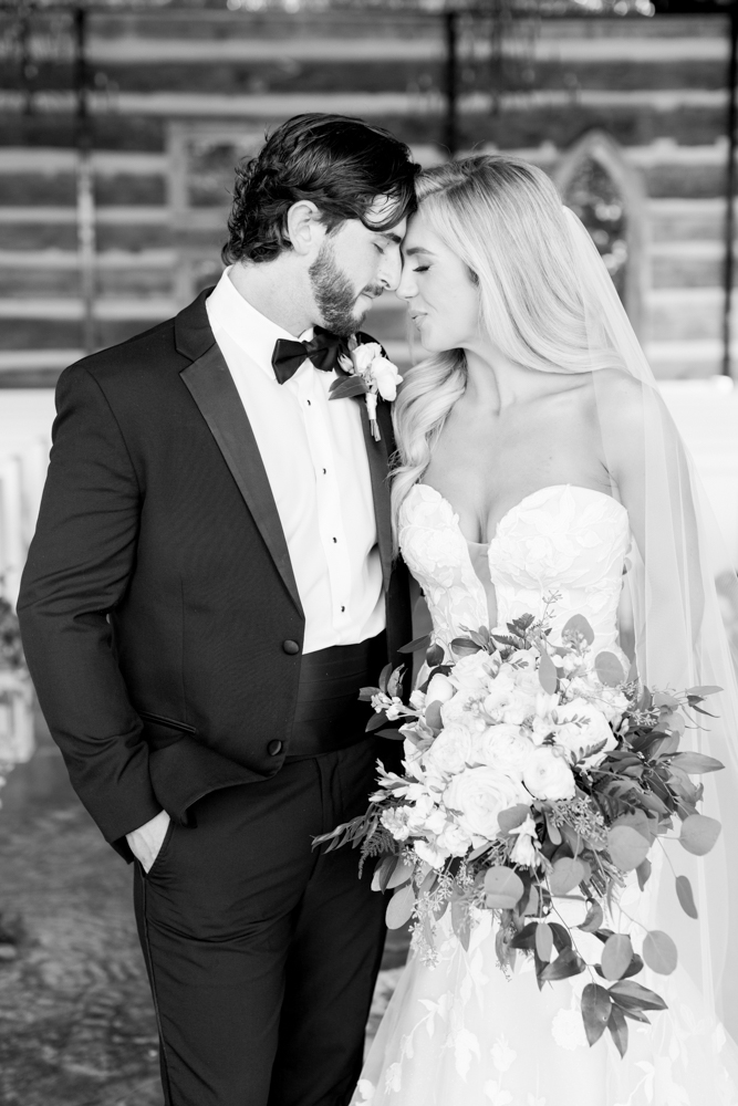 The bride and groom touch foreheads before their Southern wedding at Burns Bluff at High Falls.