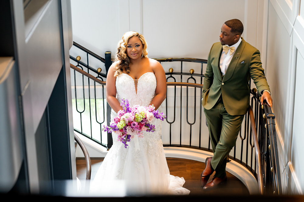 The bride holds her bouquet before her Birmingham wedding ceremony.