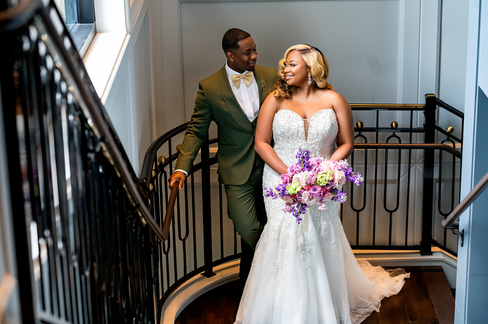 The bride and groom pose together before their Birmingham wedding.