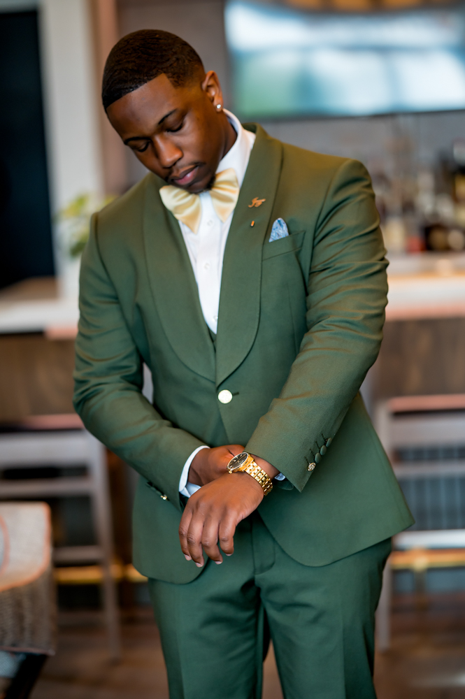 The groom adjusts his watch before a Birmingham wedding in Alabama.