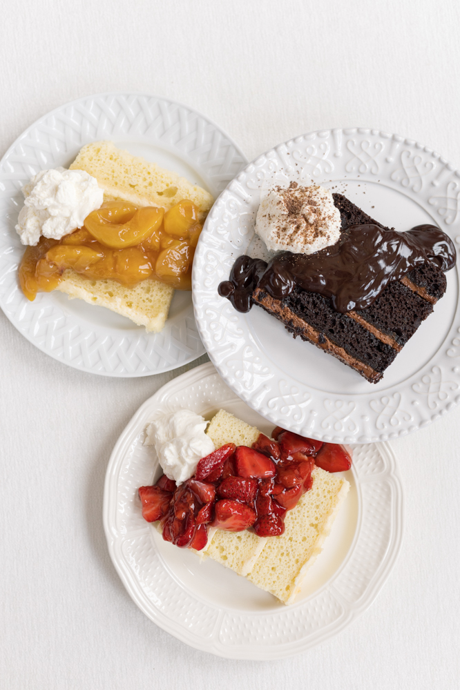 Cake slices by Olexa's Cafe are topped with fruit compote and chocolate ganache.