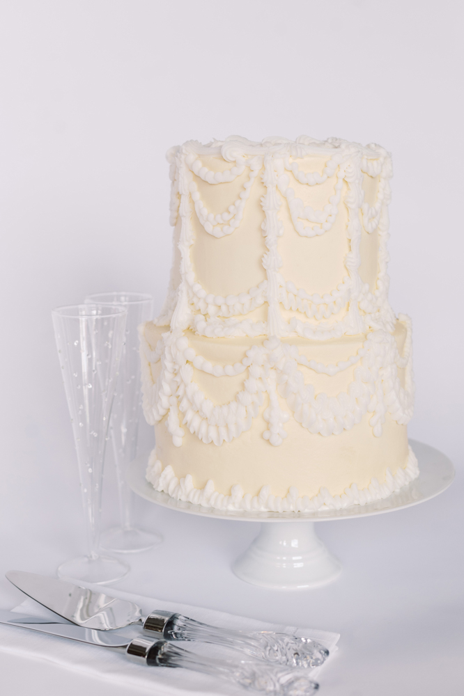 Olexa's Cafe presents a Southern wedding cake with beautiful piping design.