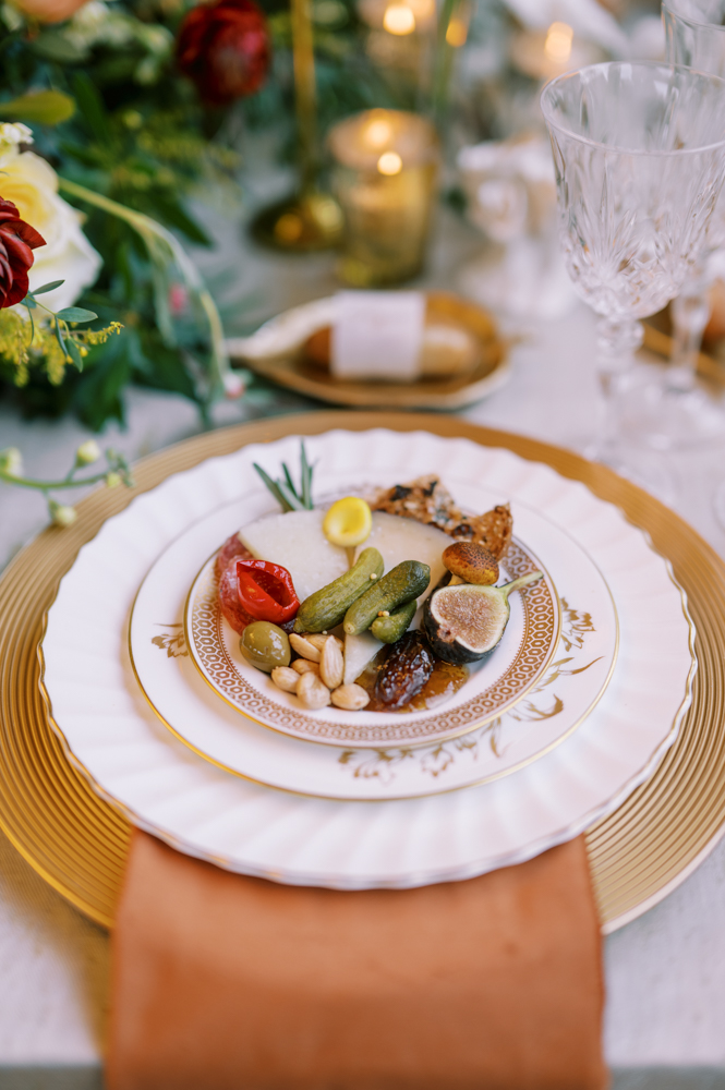 Each place setting of this autumn tablescape features a personal charcuterie plate for every guest.