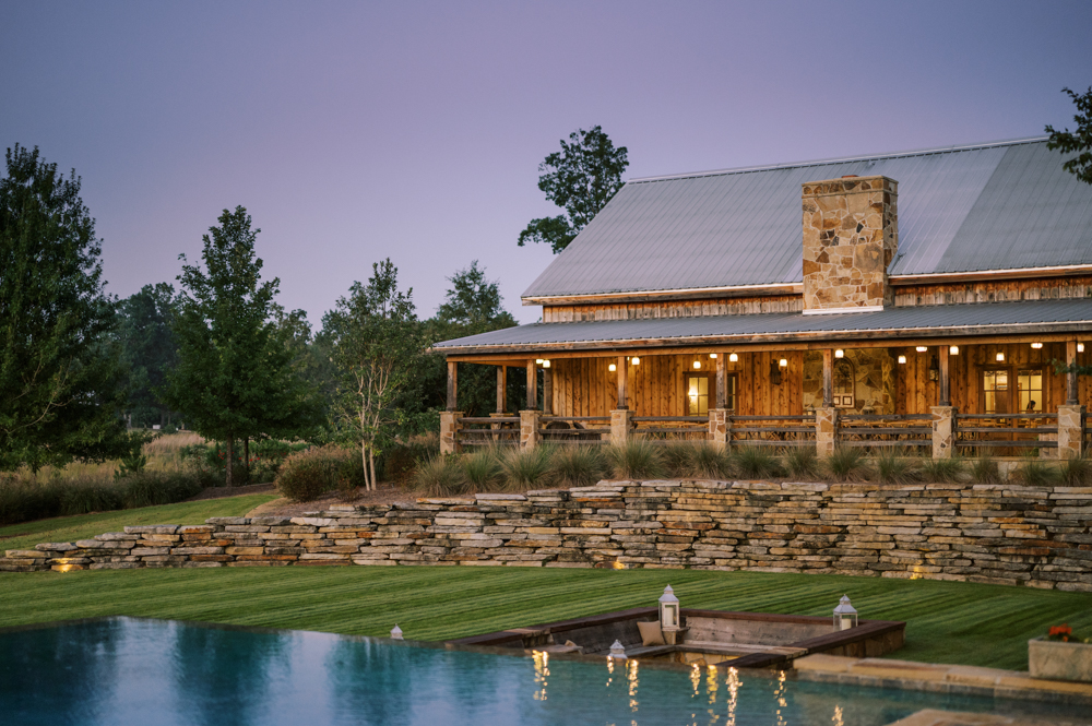 The sun sets on a beautiful evening at top Alabama wedding venue, Otter Creek Farmstead in Ohatchee.