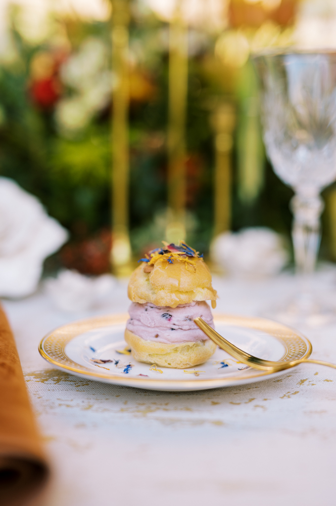 Dessert for this Southern fall wedding is an eclair bite by Savoie Catering.