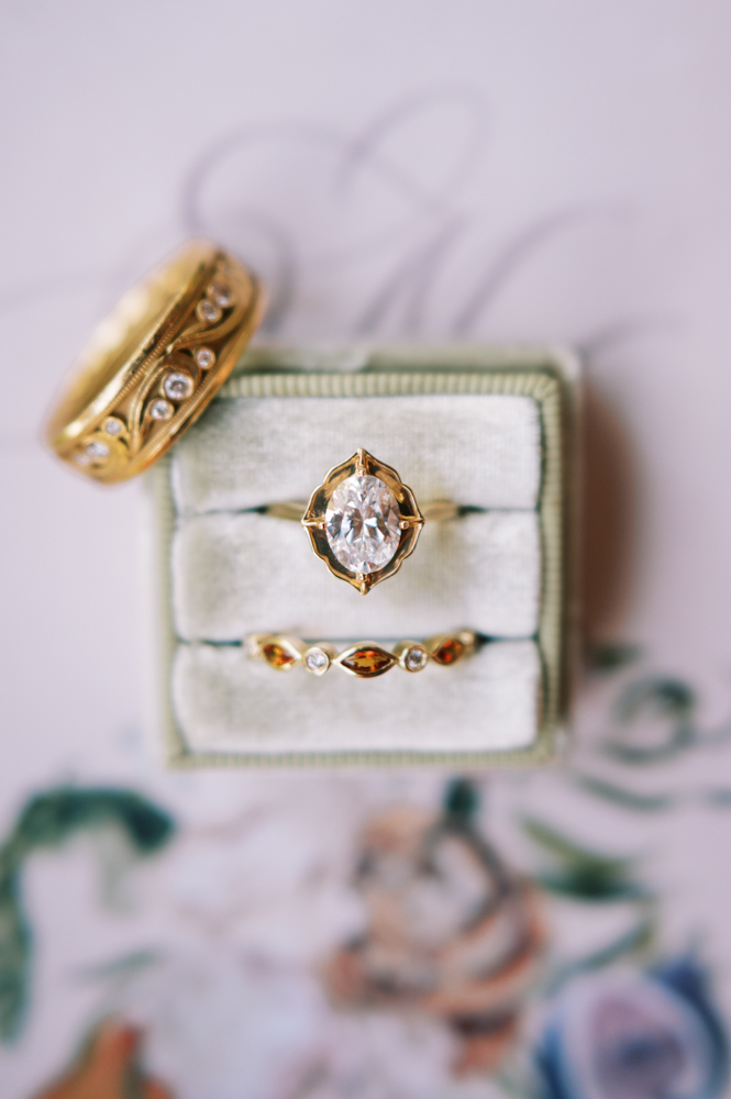 Twenty Oaks Photography captures wedding jewelry from Diamonds Direct in a ring box.