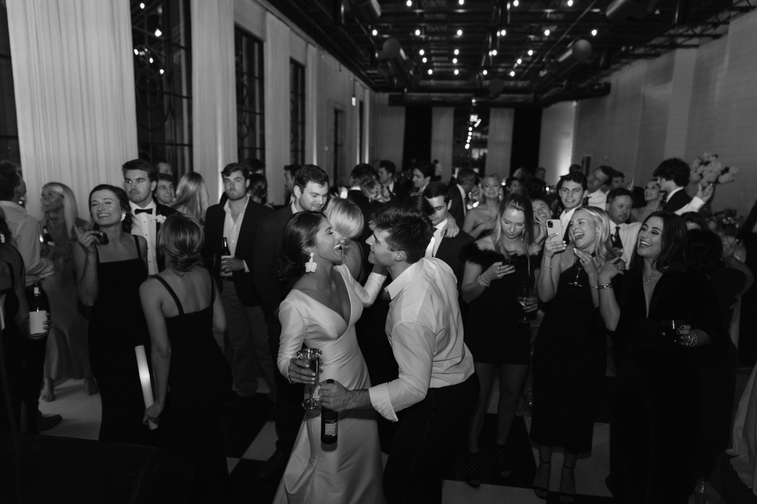 A crowd dances together during a wedding reception at The Farrell in Homewood, Alabama.