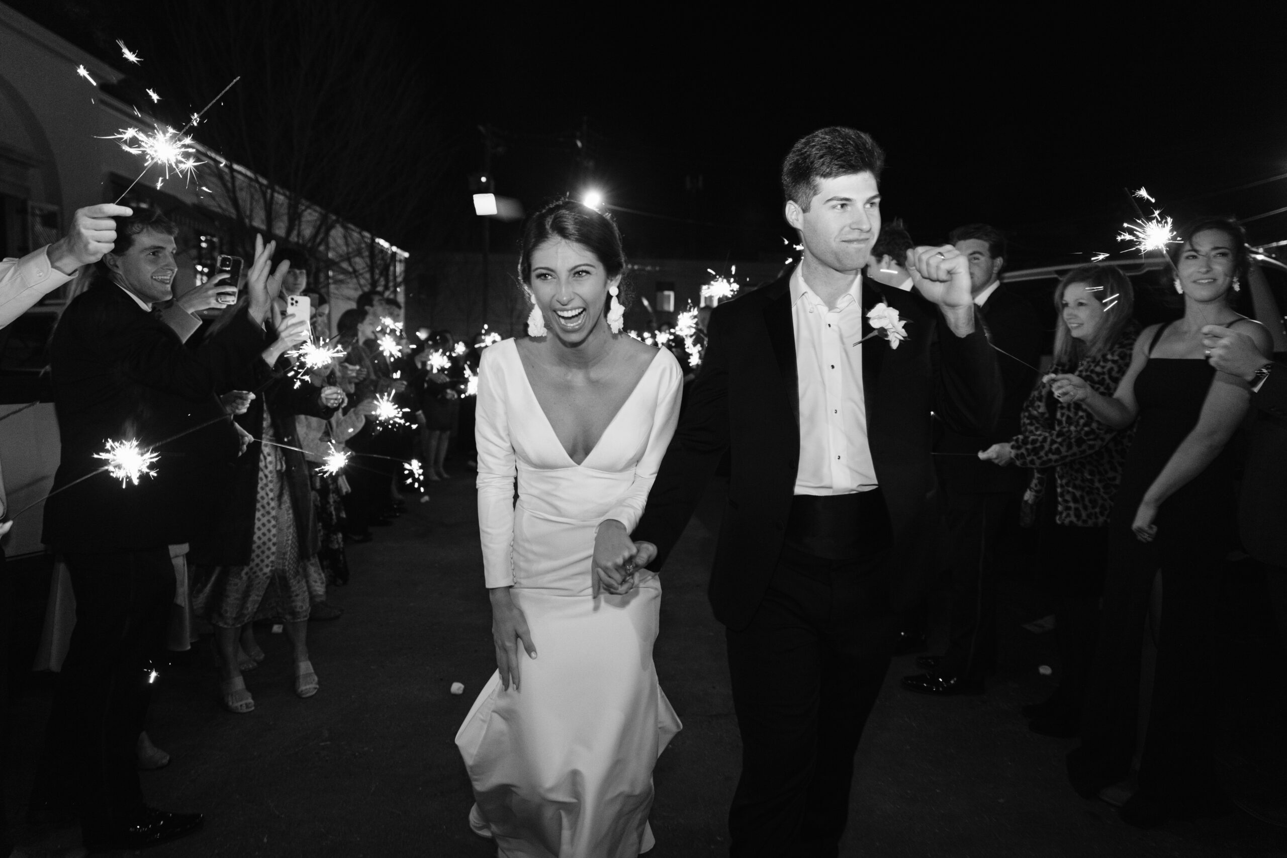 The bride and groom make their grand exit after their wedding reception at The Farrell in Homewood, Alabama.