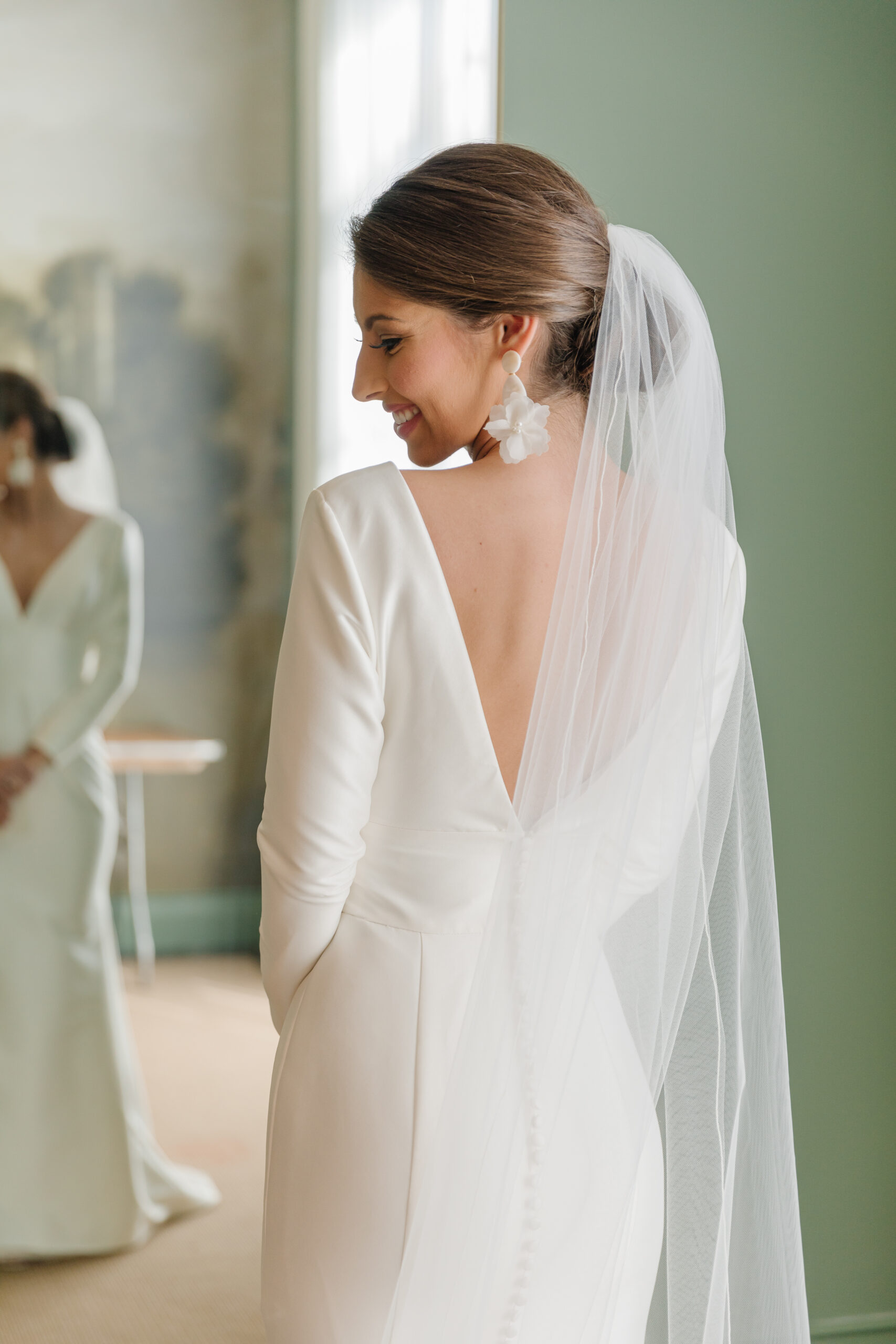 The bride poses in her wedding gown at The Farrell in Homewood, Alabama.