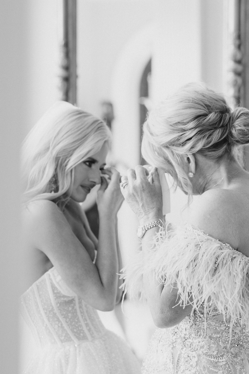 An Alabama bride and mother of the bride share a special moment before the wedding ceremony.