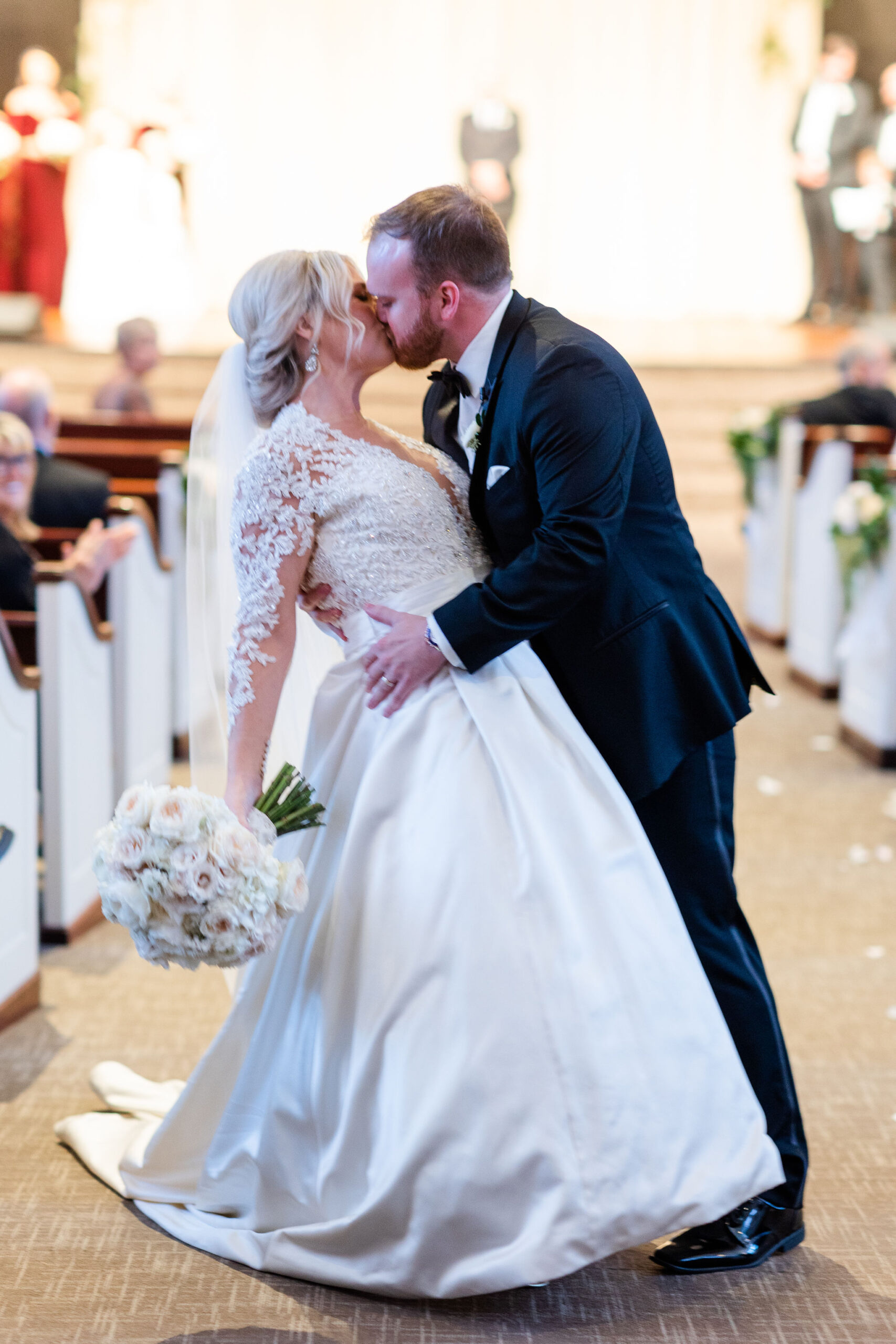 The bride and groom kiss during their Southern wedding.