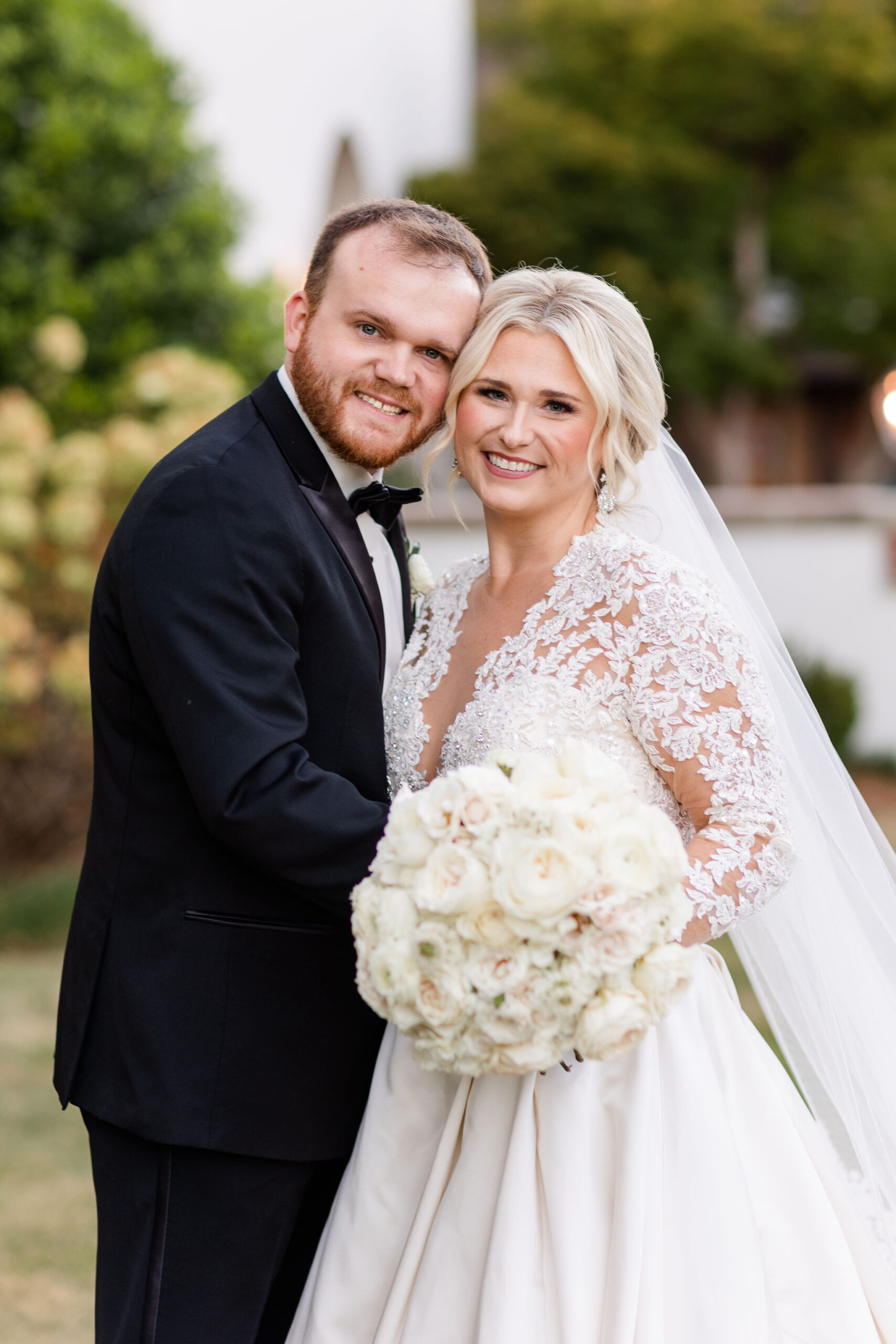 The bride and groom smile together at Grand Bohemian Hotel Mountain Brook.