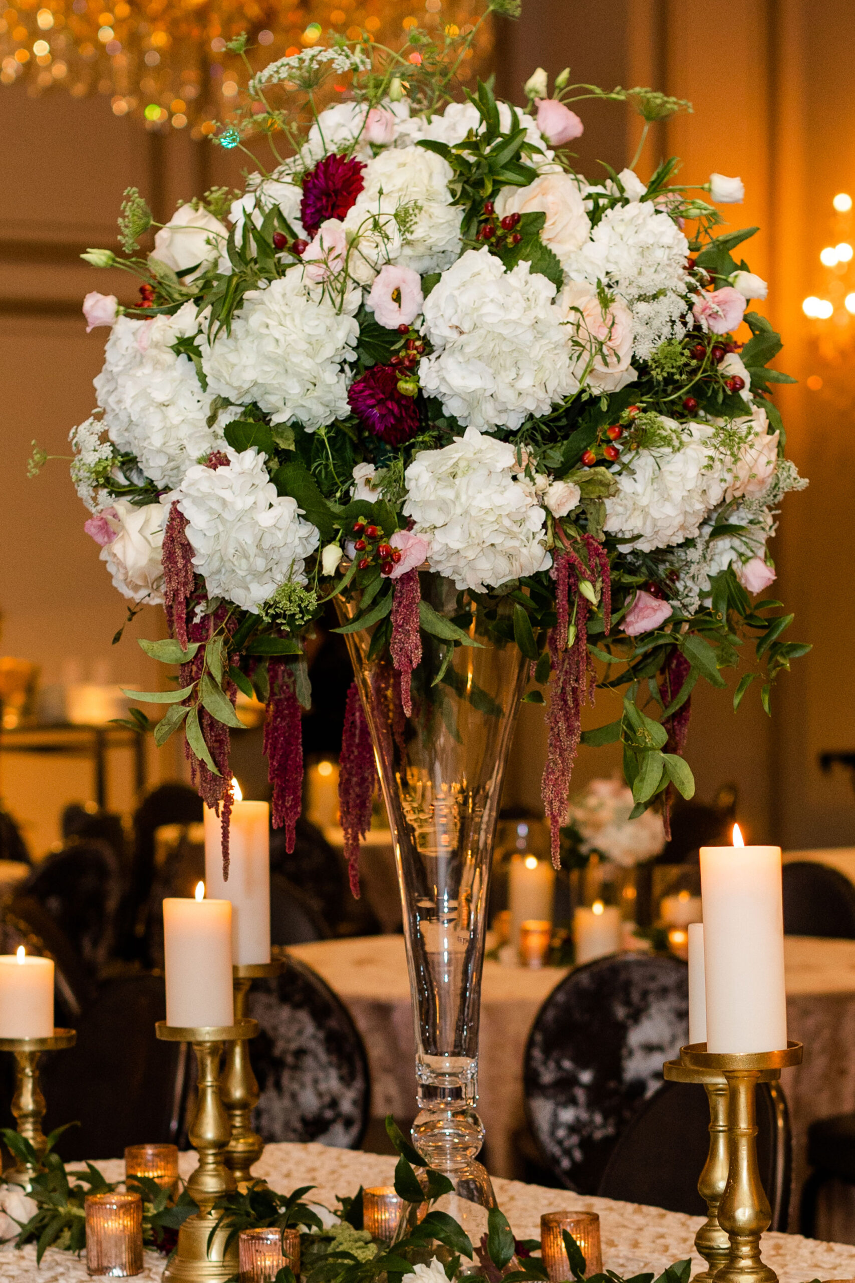 The tablescape at Grand Bohemian Hotel Mountain Brook is decorated with flowers and candles.