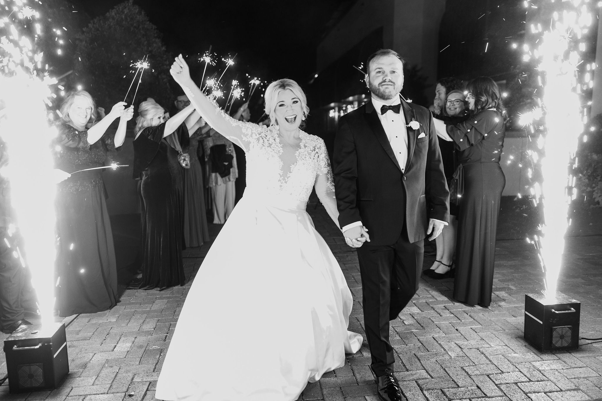 The bride and groom exit their Southern wedding reception at Grand Bohemian Hotel Mountain Brook.