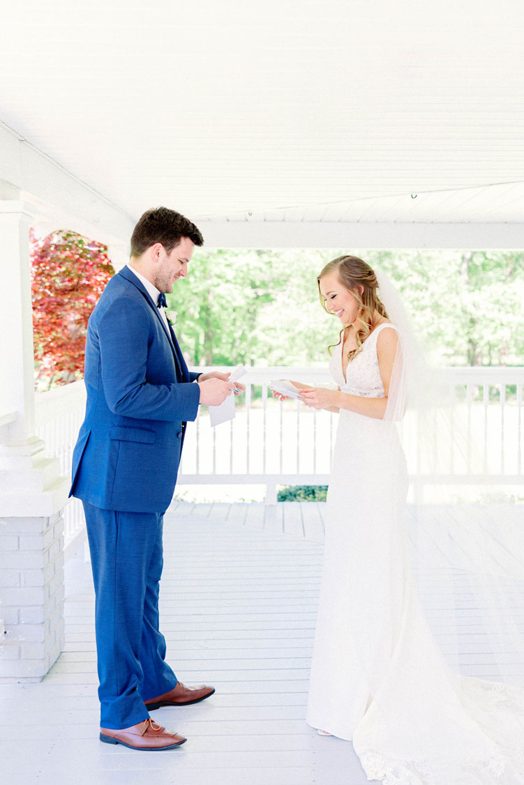 The bride and groom read letters from each other on the porch of The Sonnet House in Alabama.