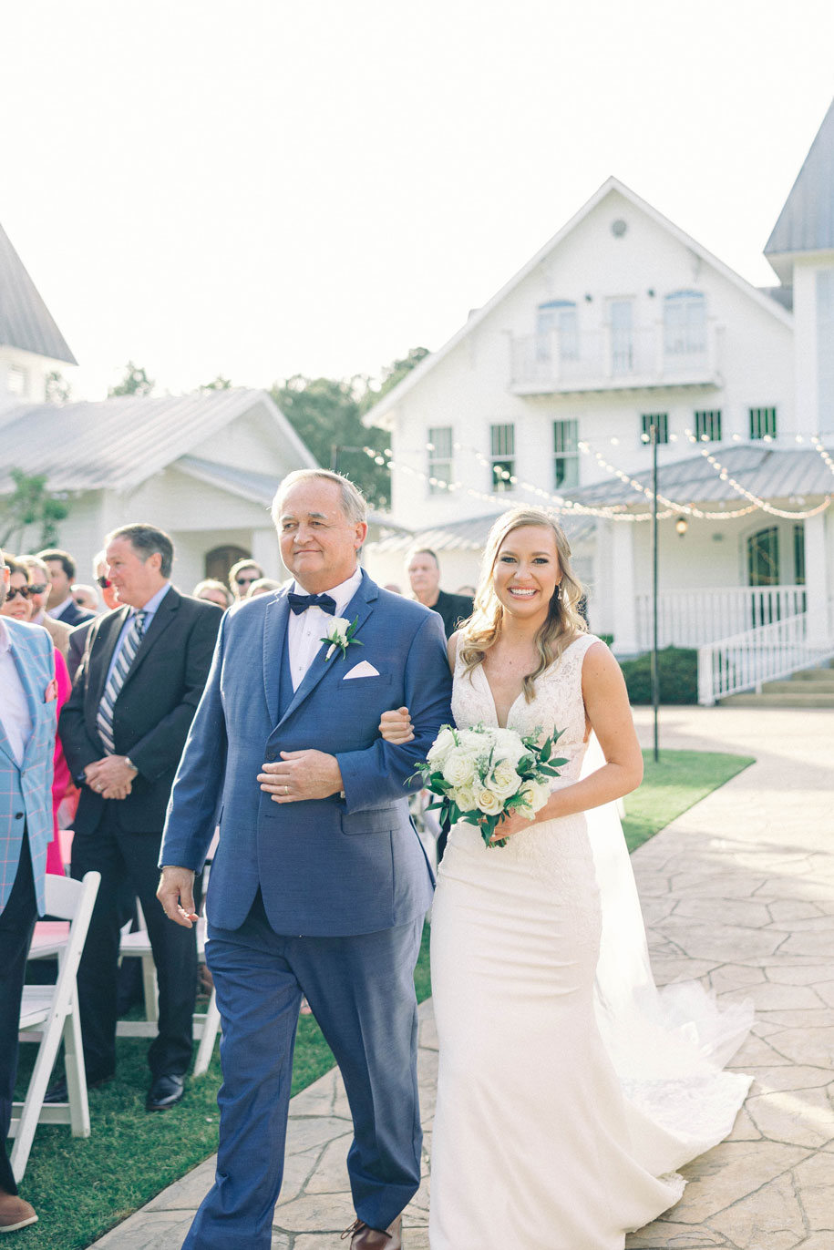 The father of the bride walks his daughter down the aisle at The Sonnet House.