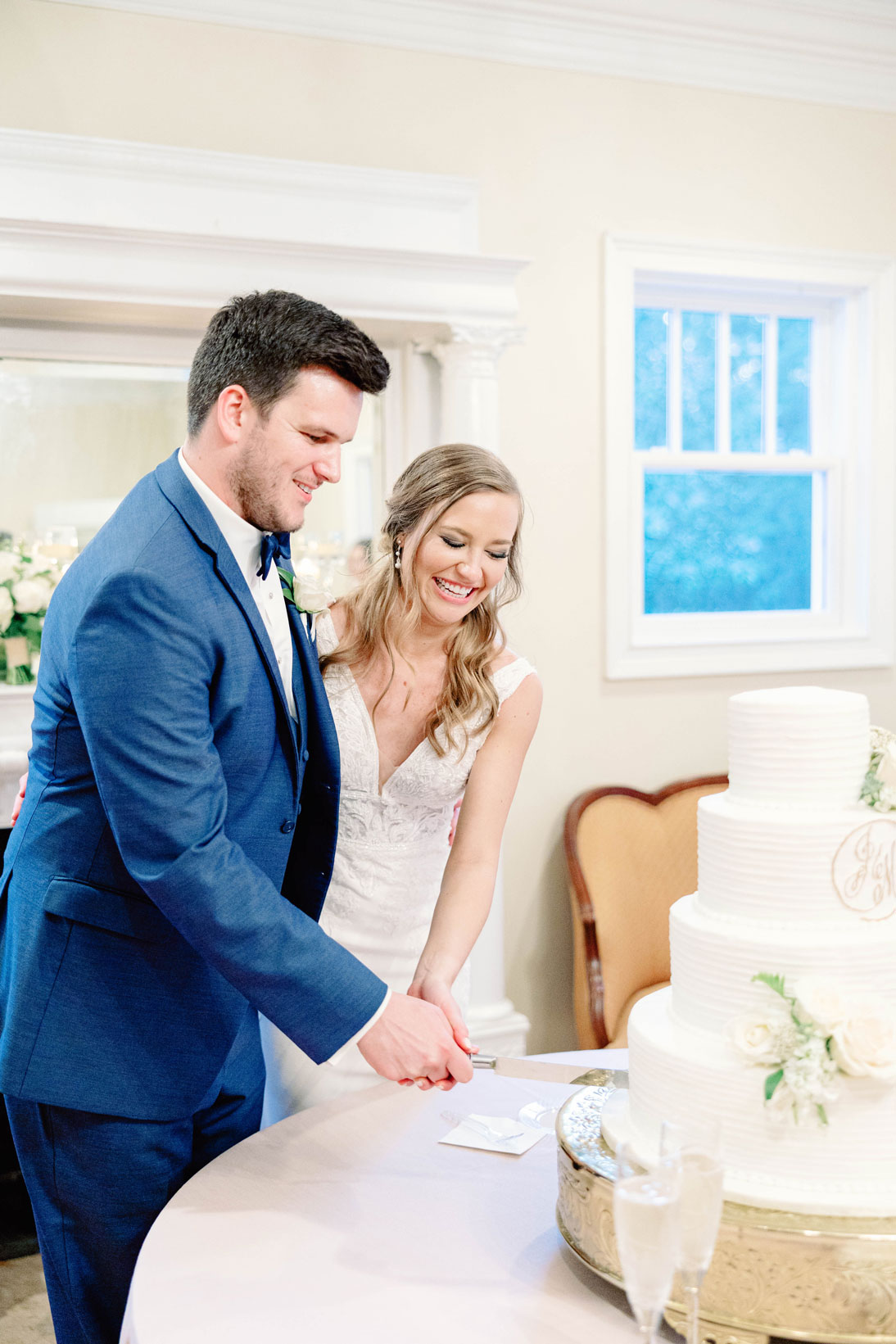 The bride and groom cut the cake at their Southern wedding.