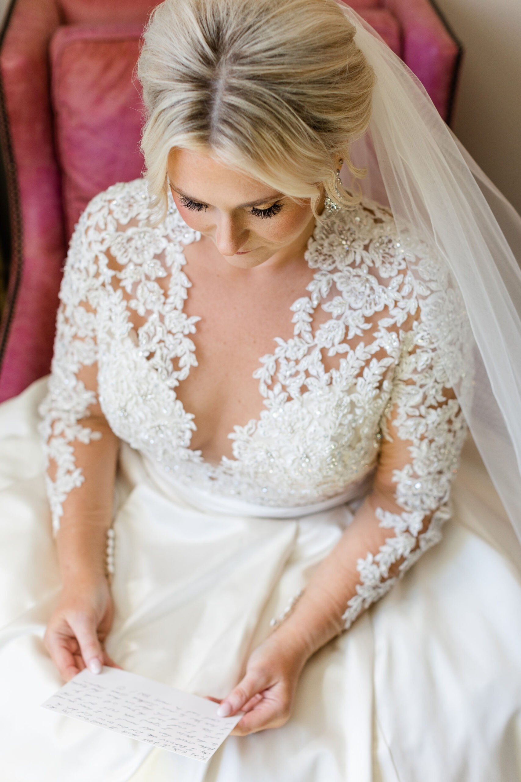 The bride reads a letter from her groom on her Alabama wedding day.