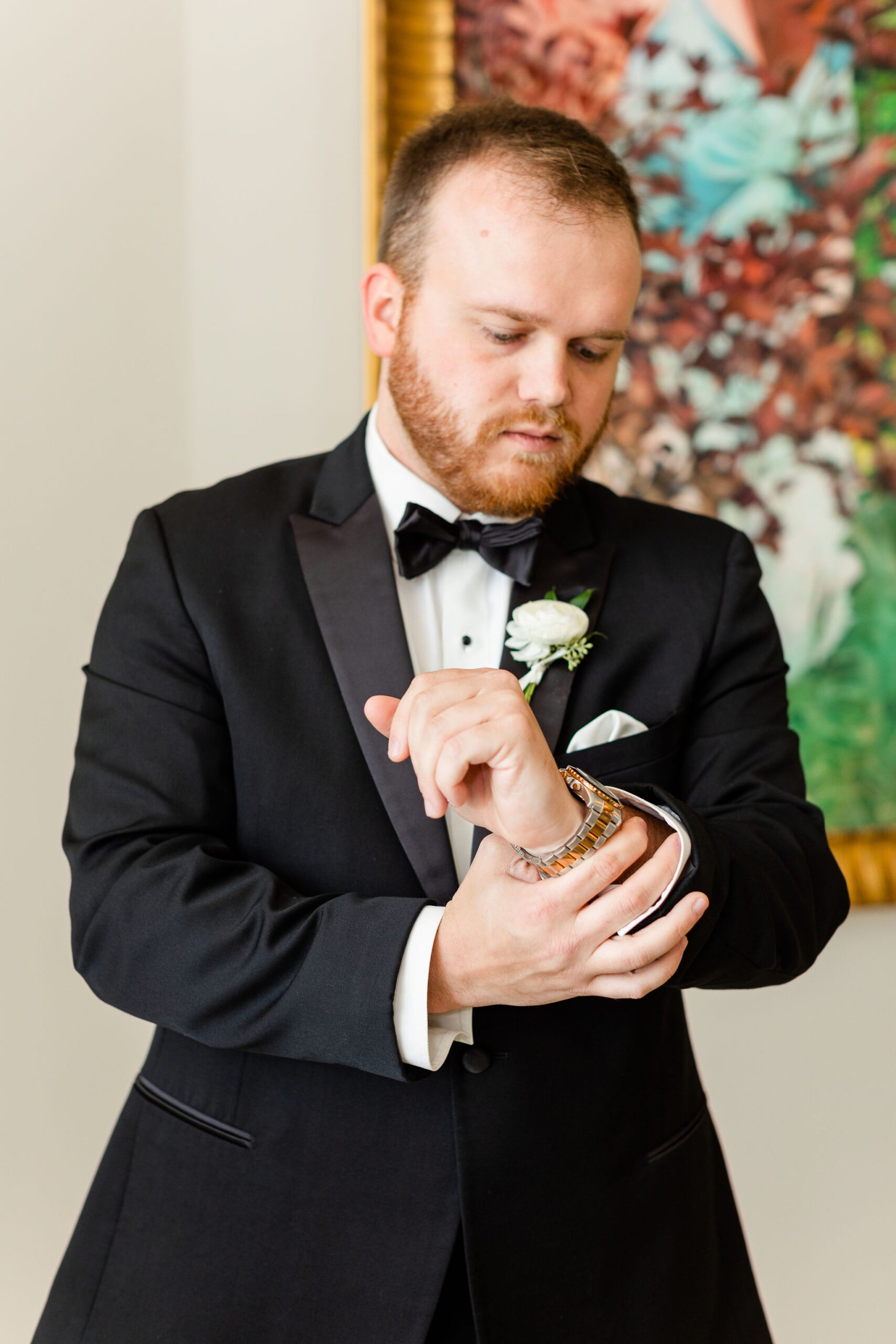 The groom checks his watch at Grand Bohemian Hotel Mountain Brook.