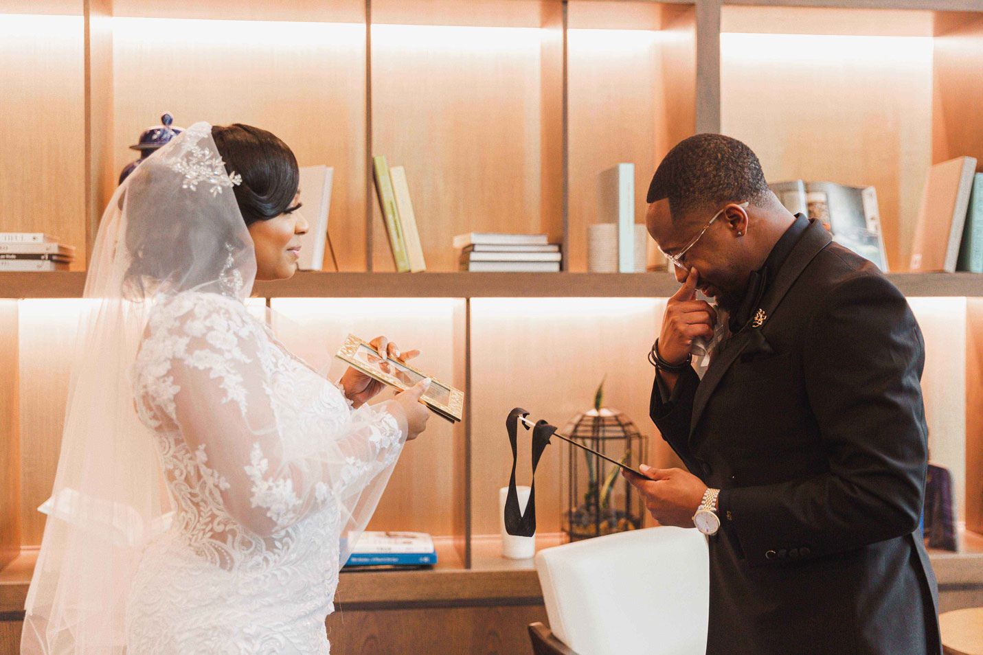 The bride gives the groom a sentimental gift at The Valley Hotel in Homewood.