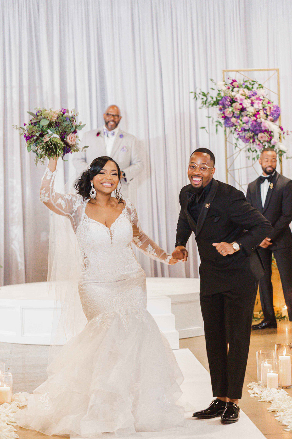 The bride and groom celebrate after their wedding ceremony at Haven in Birmingham, Alabama.