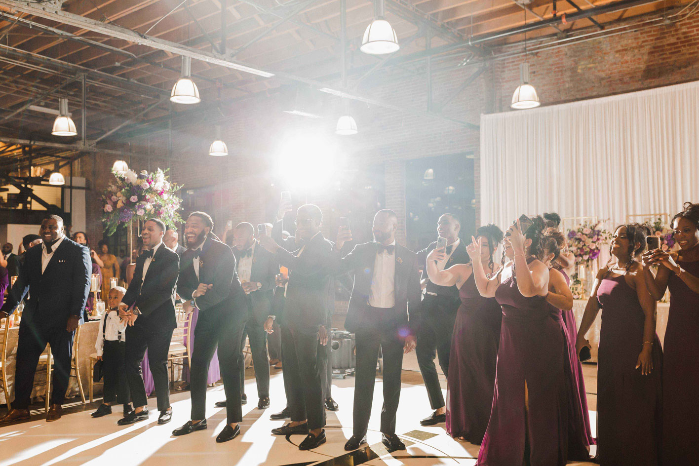 The wedding party awaits the happy couple at the reception at Haven in downtown Birmingham.