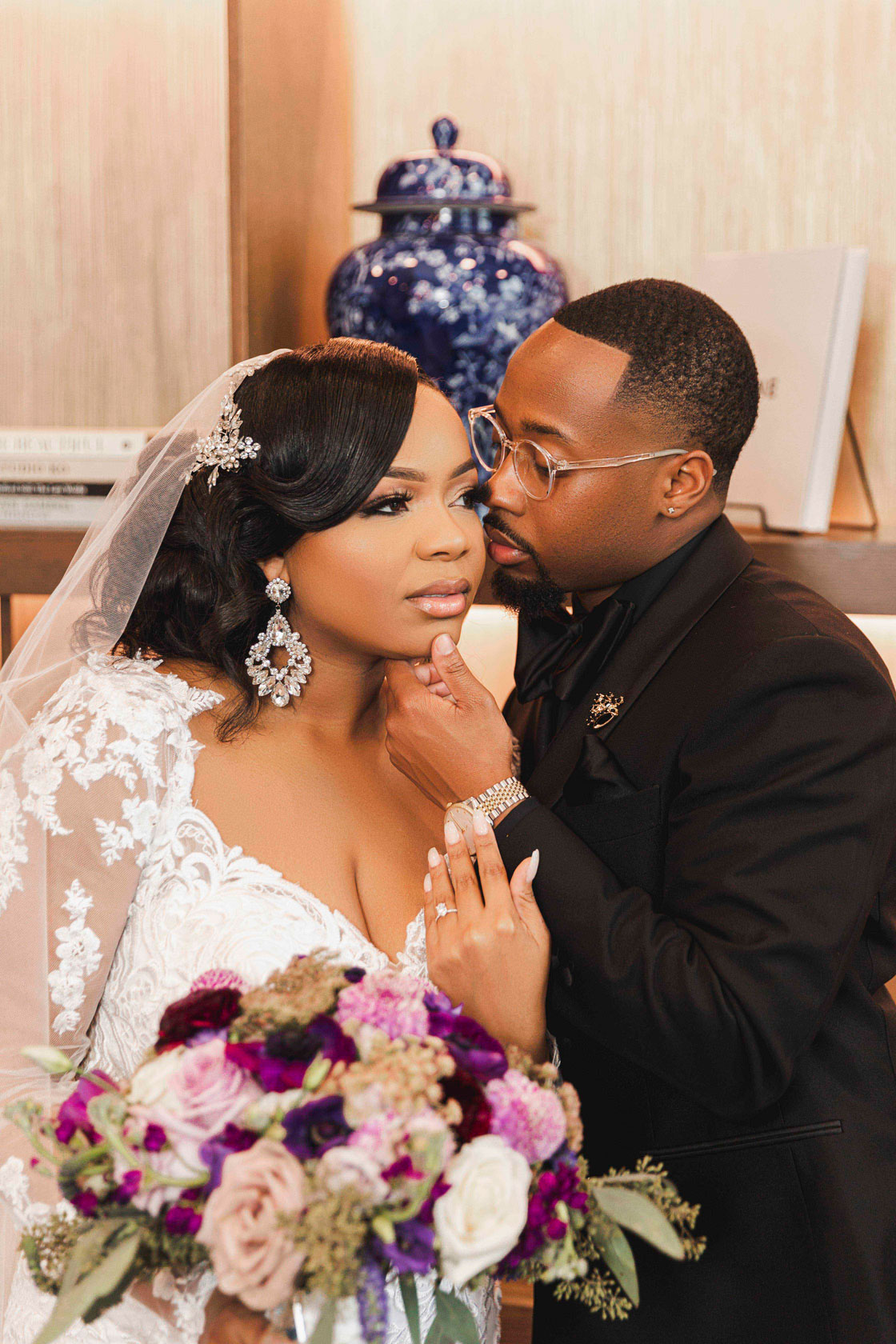 The groom kisses the bride at The Valley Hotel in Homewood.