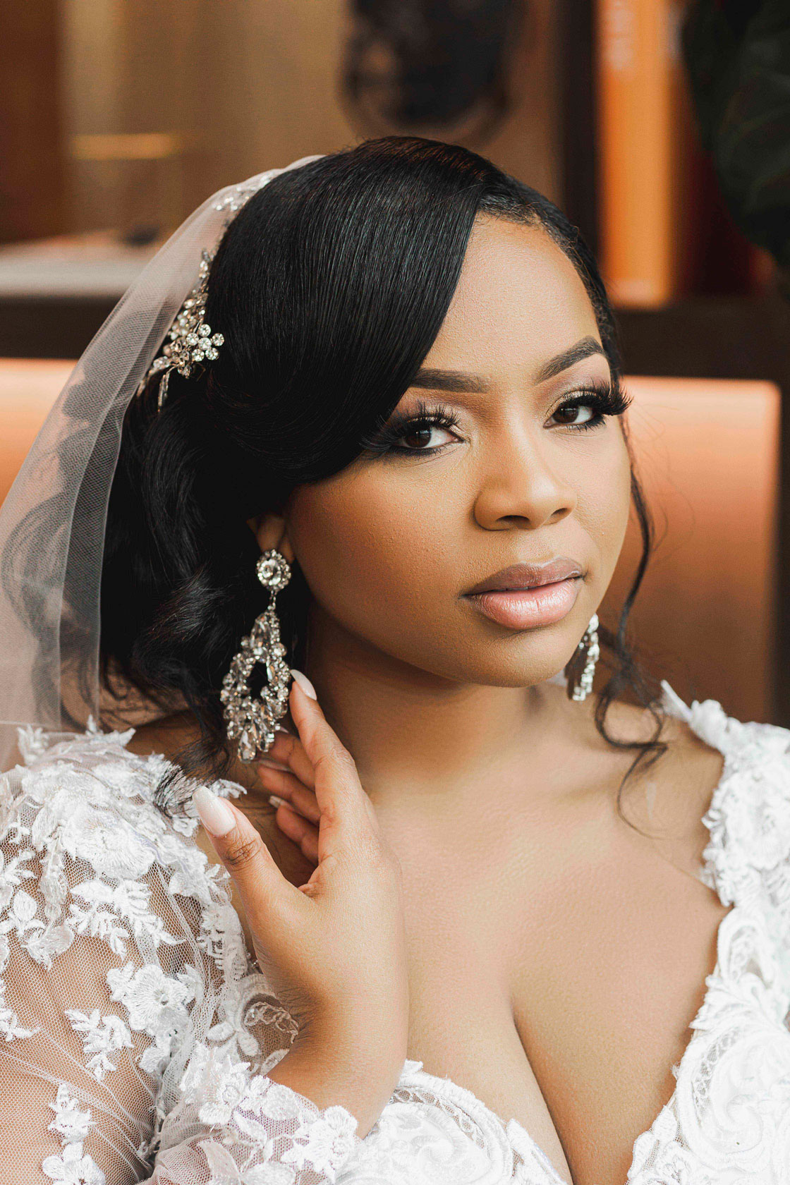 The bride shows her earrings as she prepares for her Birmingham wedding.