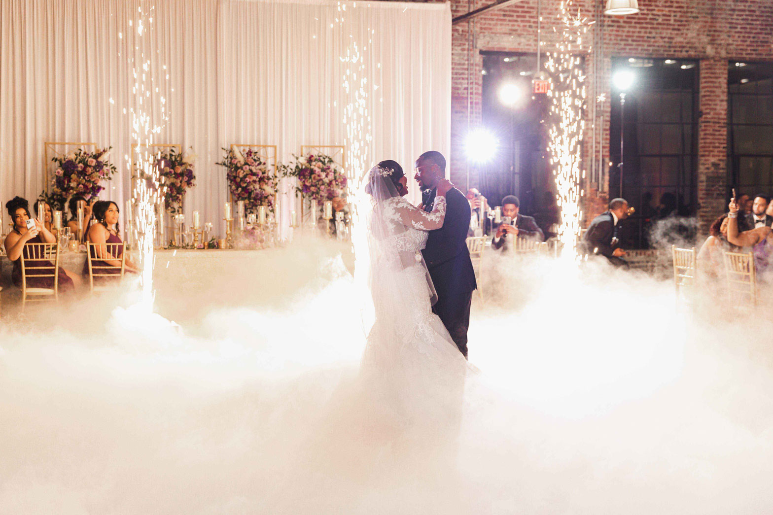 The couple shares a first dance with cold sparks during their wedding reception at Haven in Birmingham.