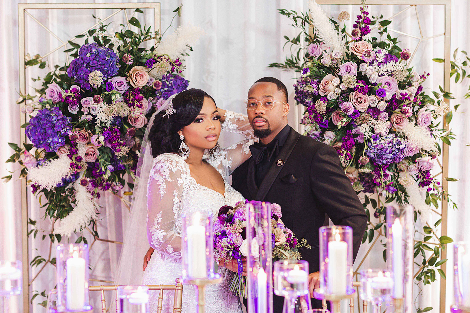 Cayla Driver & LaMarcus Jones stand at the head table of the wedding reception at Haven in Birmingham.