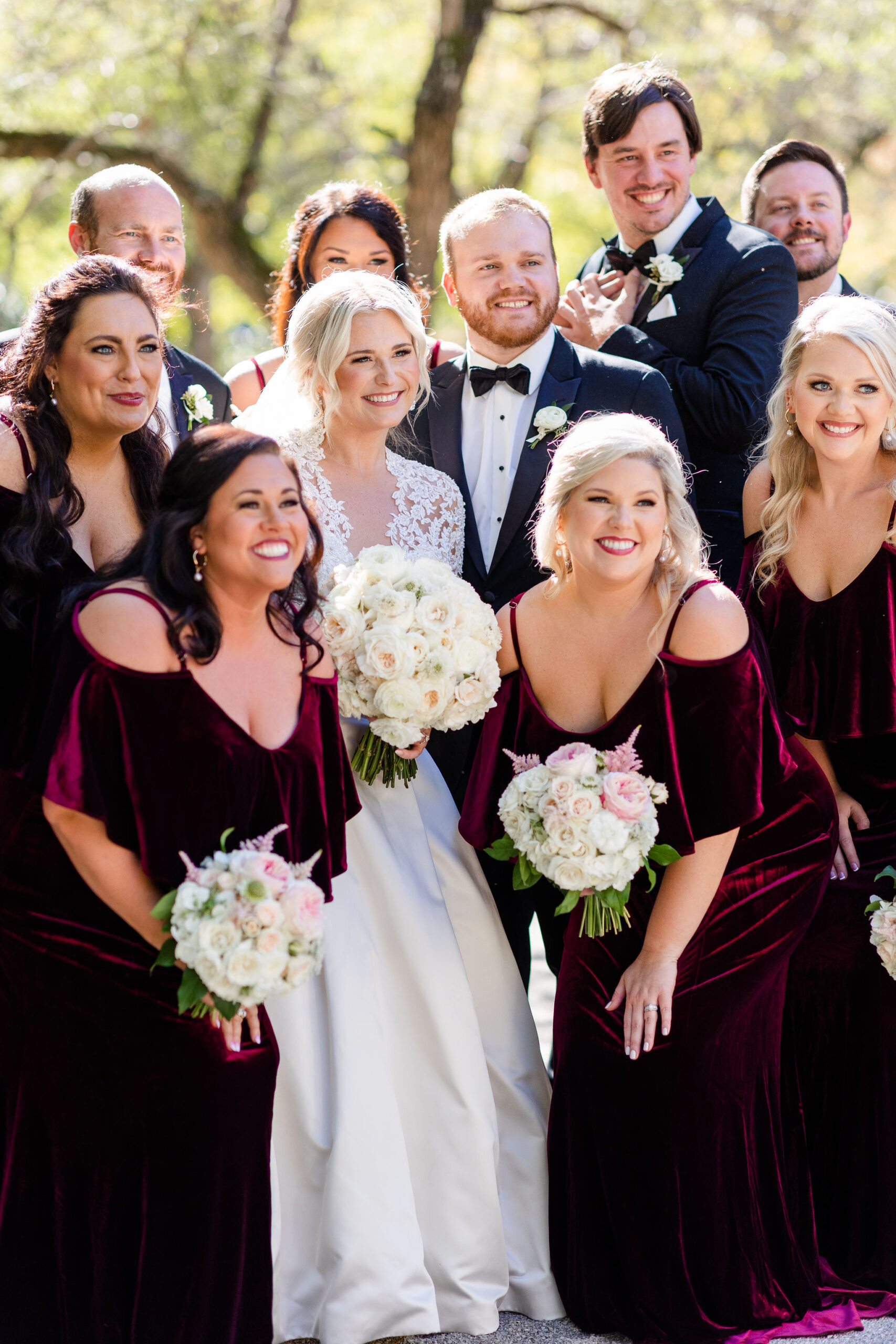 The wedding party smiles together before a Southern wedding.