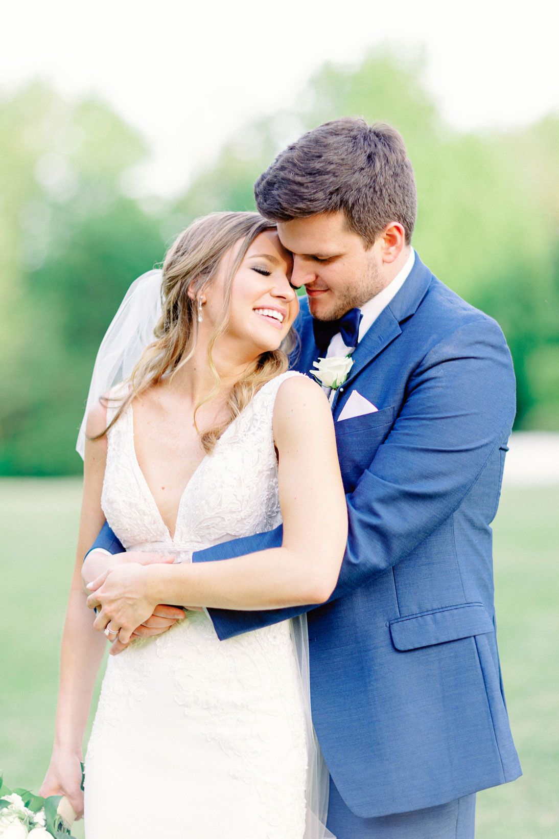 The bride and groom embrace before their Southern wedding.