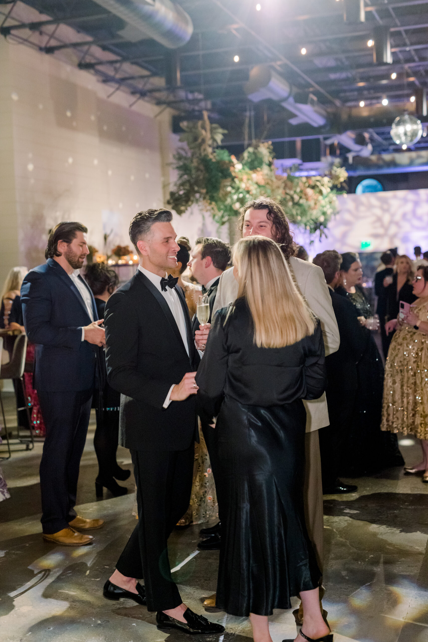 Guests talk with each other at the Alabama Weddings party at The Farrell.