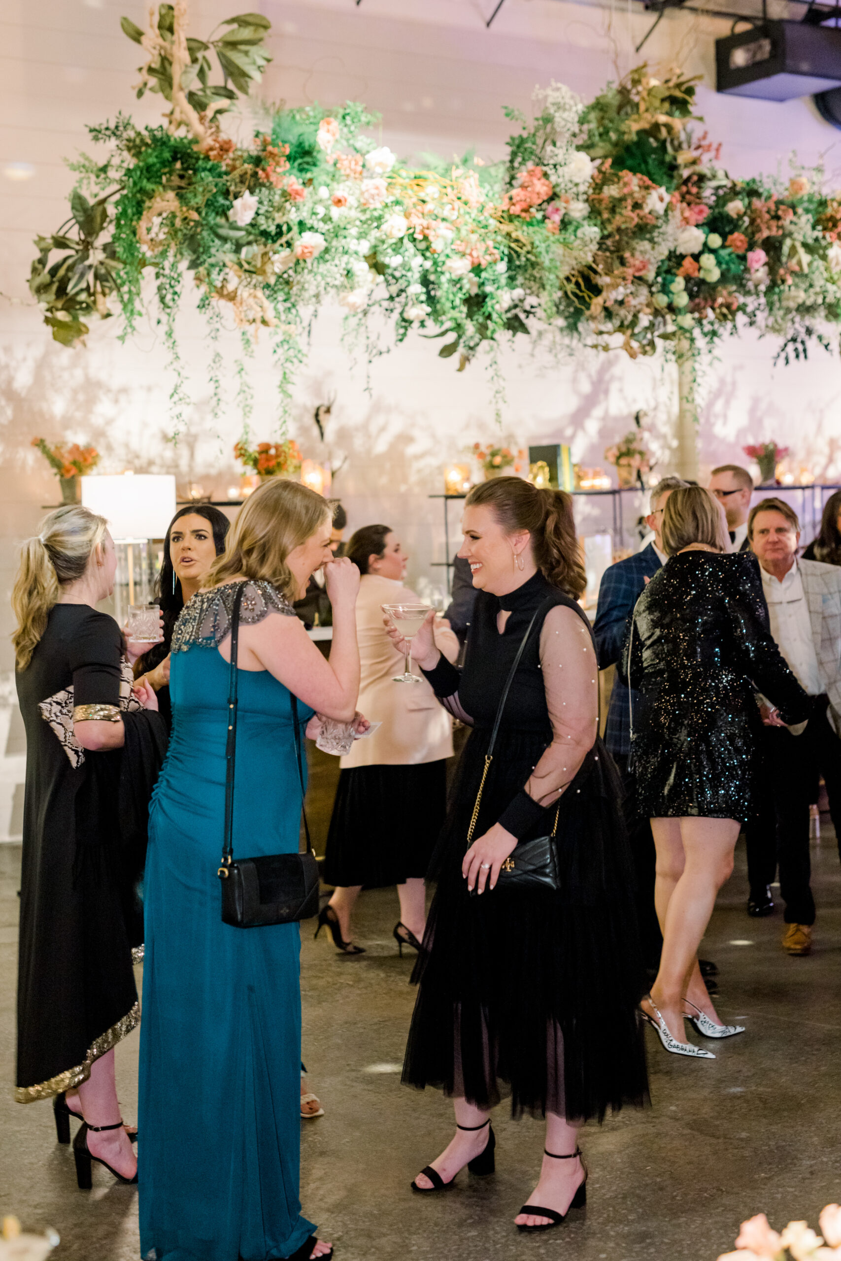 Guests enjoy a cocktails and conversation at the Alabama Weddings party.