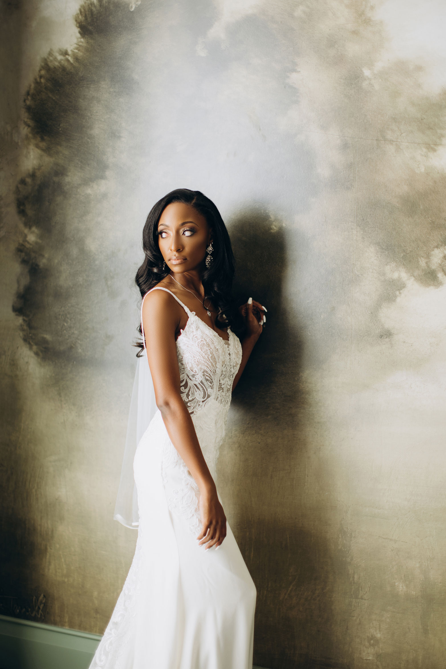 The bride poses for a portrait at The Farrell for her wedding Homewood, Alabama.