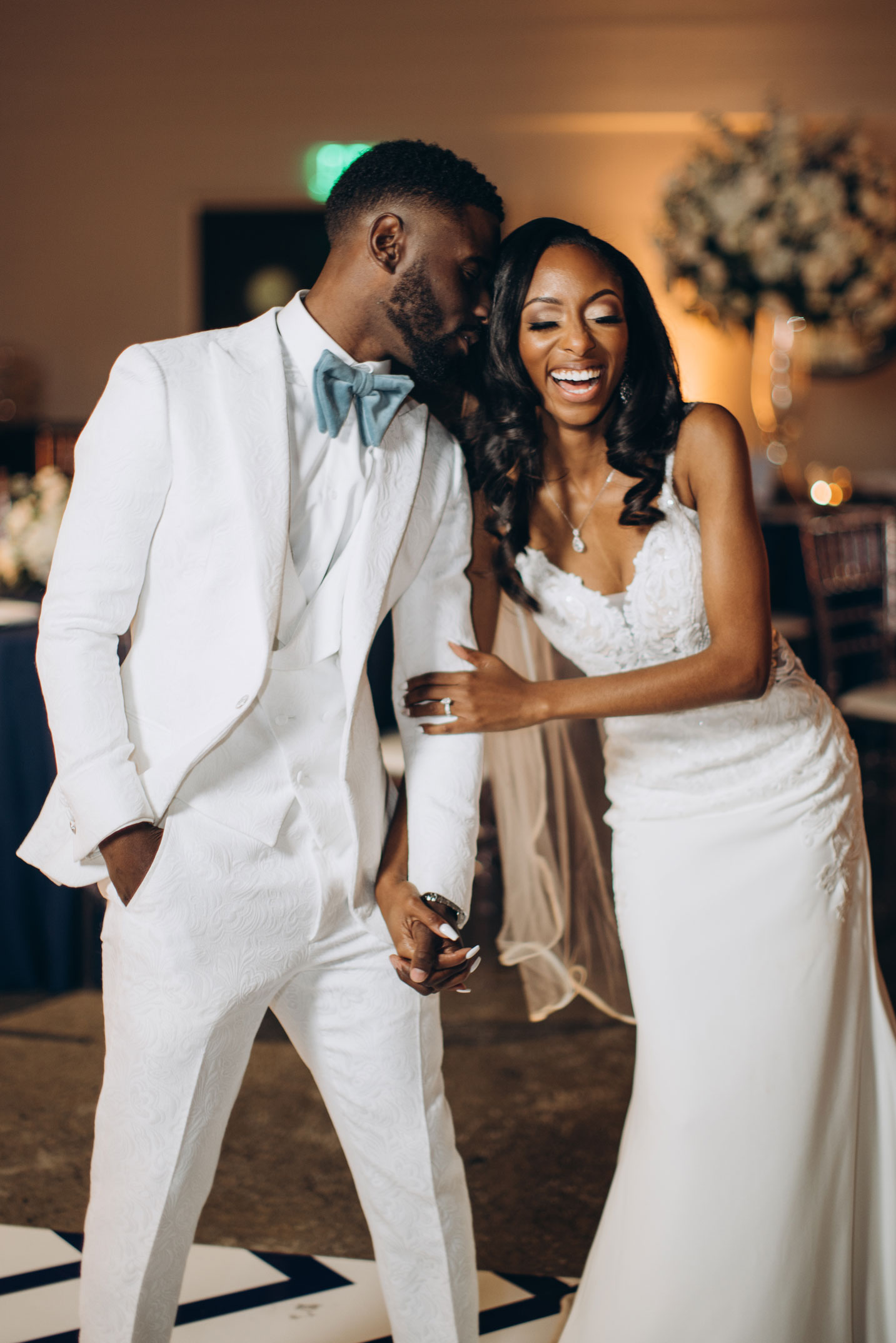 The bride and groom laugh together during the wedding at The Farrell in Homewood, Alabama.