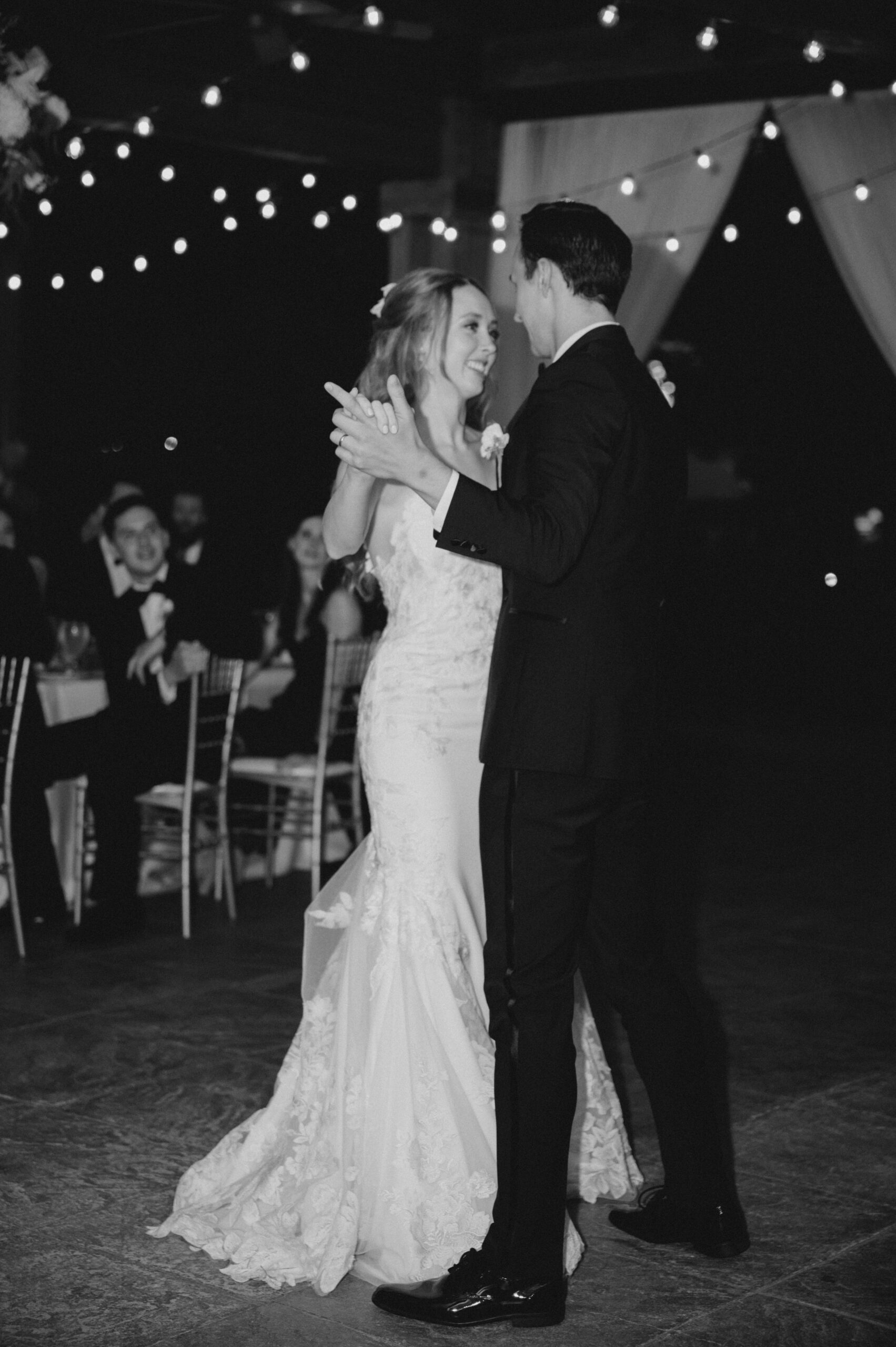 The bride and groom dance together during their Southern garden wedding reception.