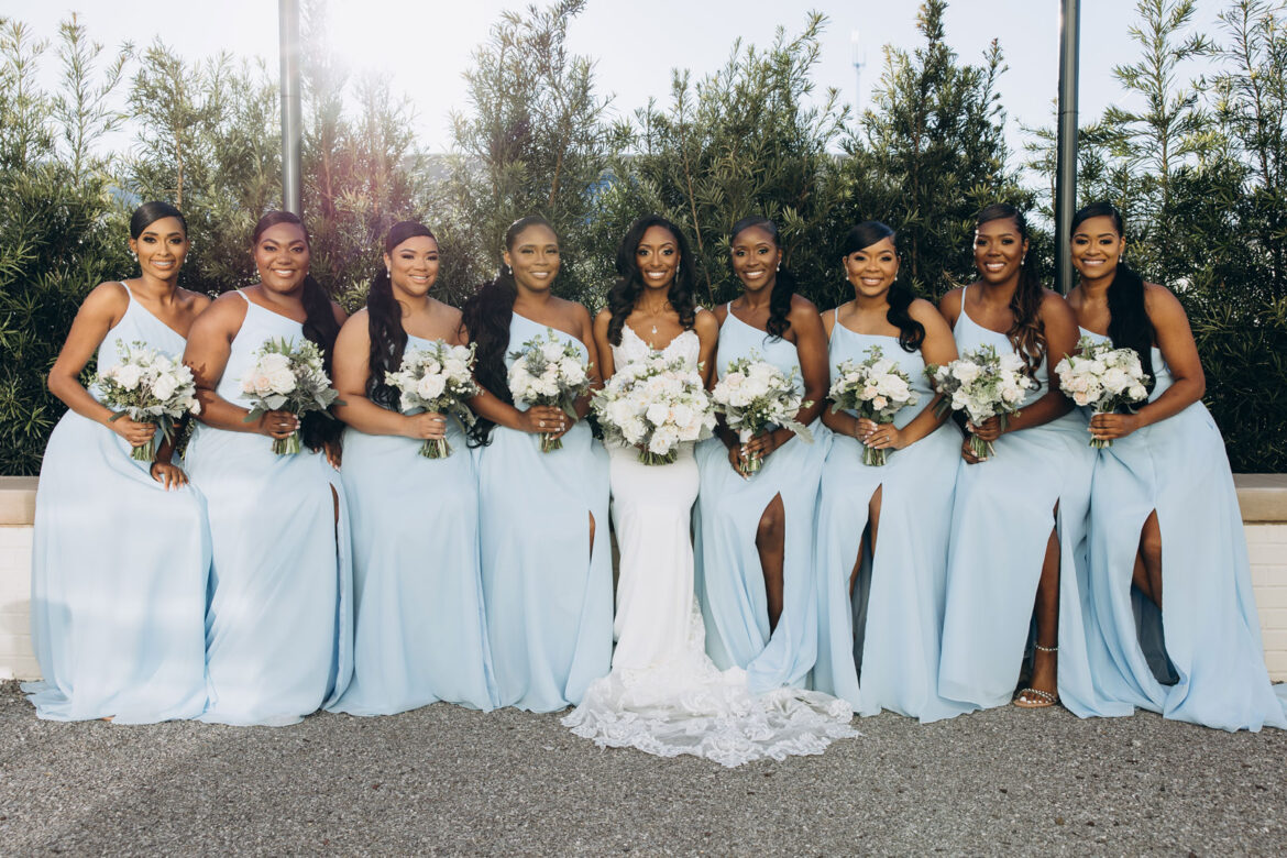 The bride and her bridesmaids hold their bouquets outside The Farrell in Homewood, Alabama.