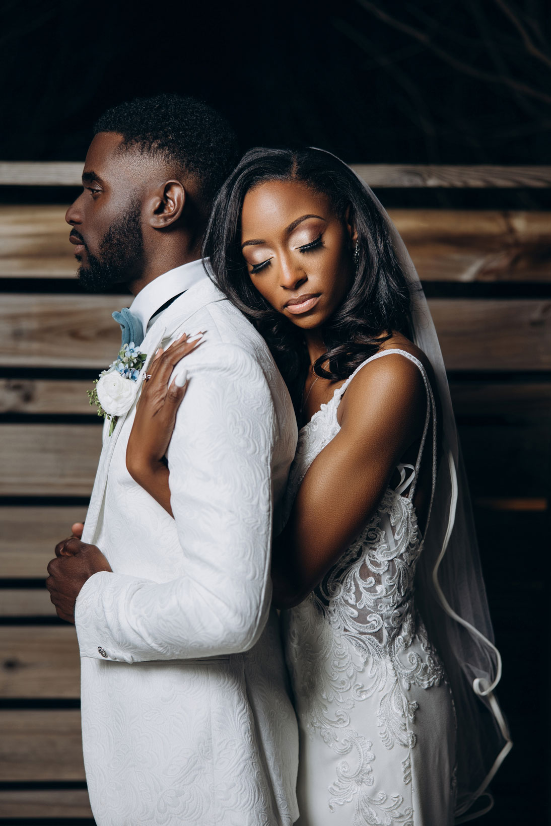 The bride holds the groom during their wedding in Birmingham.