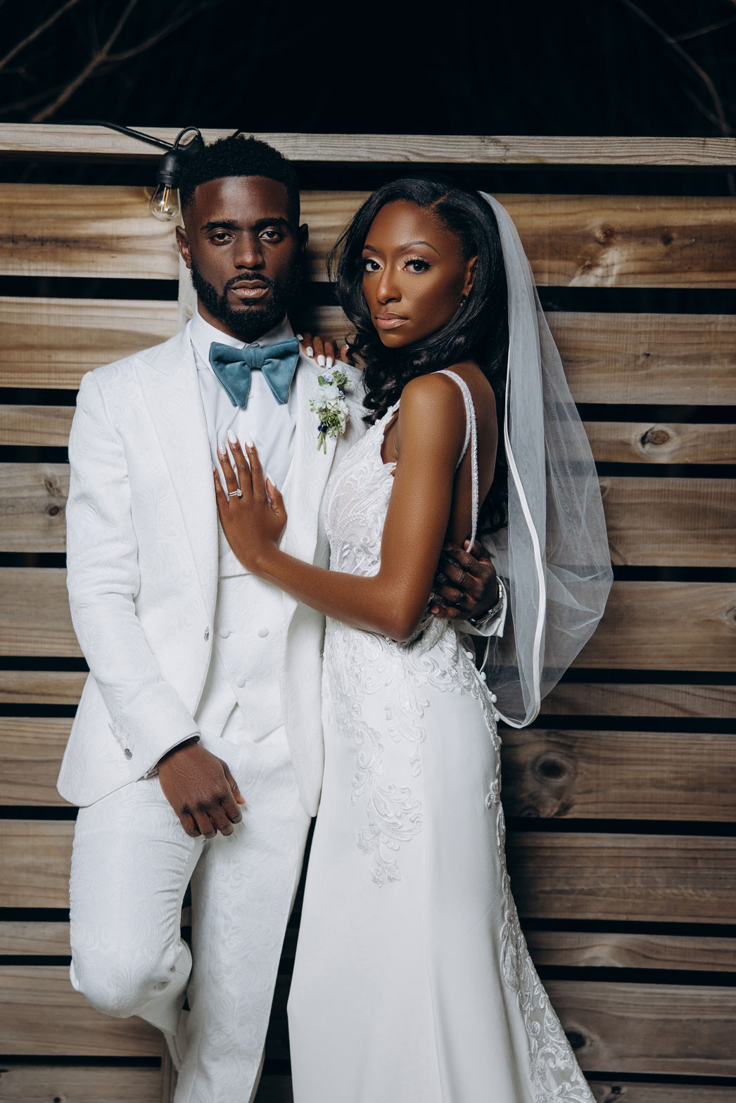 The bride and groom embrace during their wedding in Birmingham, Alabama.