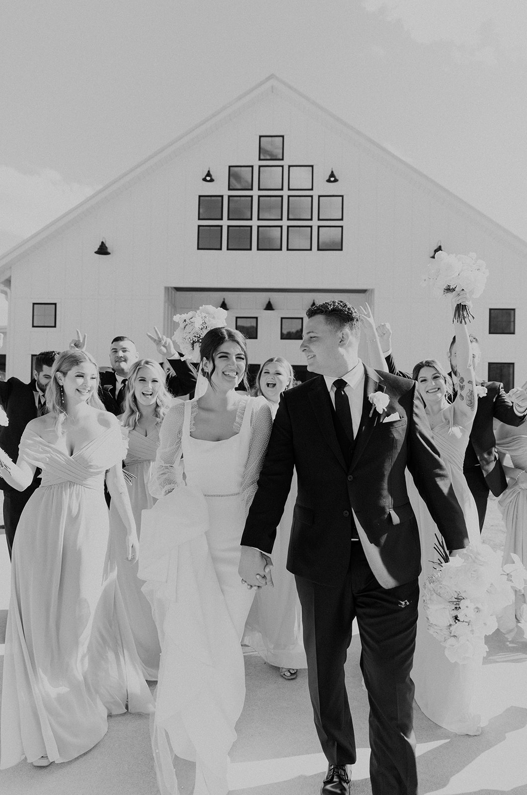 The wedding party walks together before the wedding ceremony at Ridge Point event venue in North Alabama.