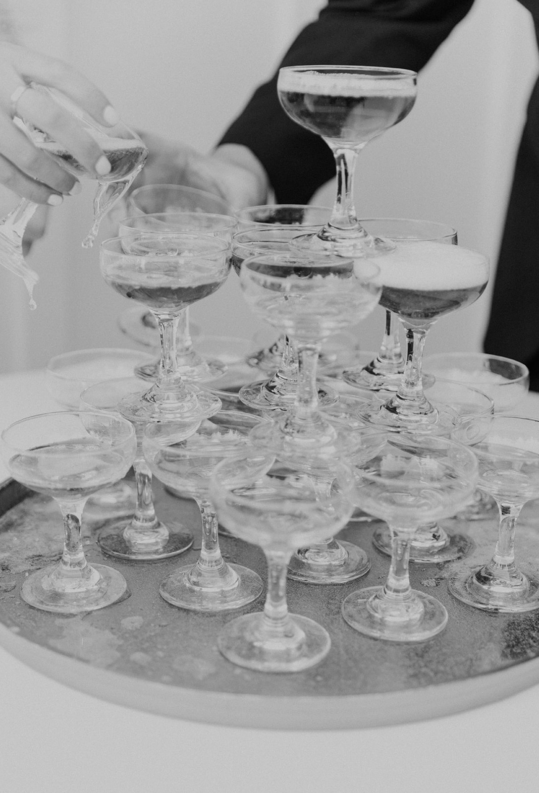 The Alabama couple creates a Champagne tower during the wedding reception.