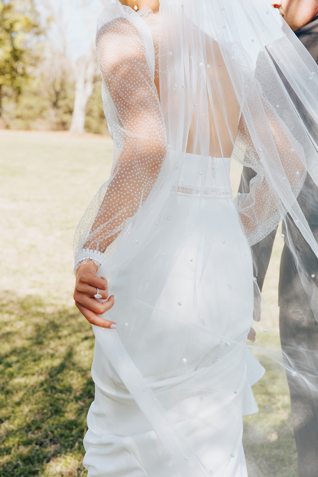 The bride's dress from Birch on Main in Huntsville, Alabama is complete with a pearled veil.