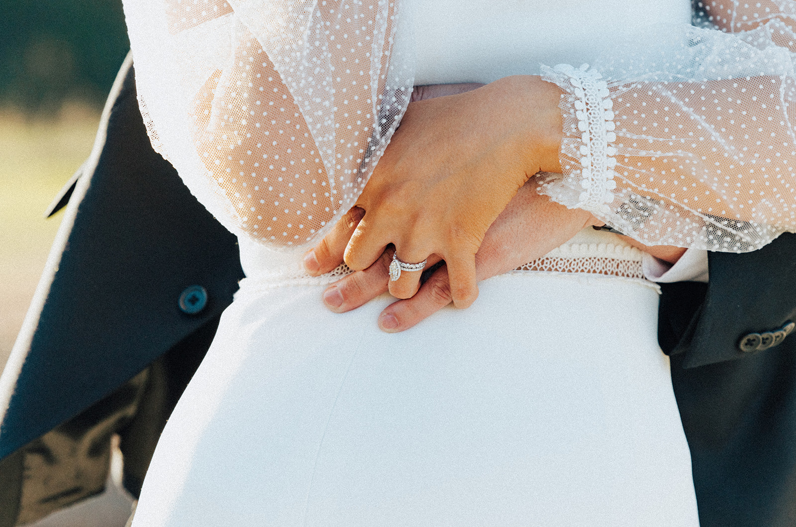 The bride and groom embrace during their wedding in Alabama.