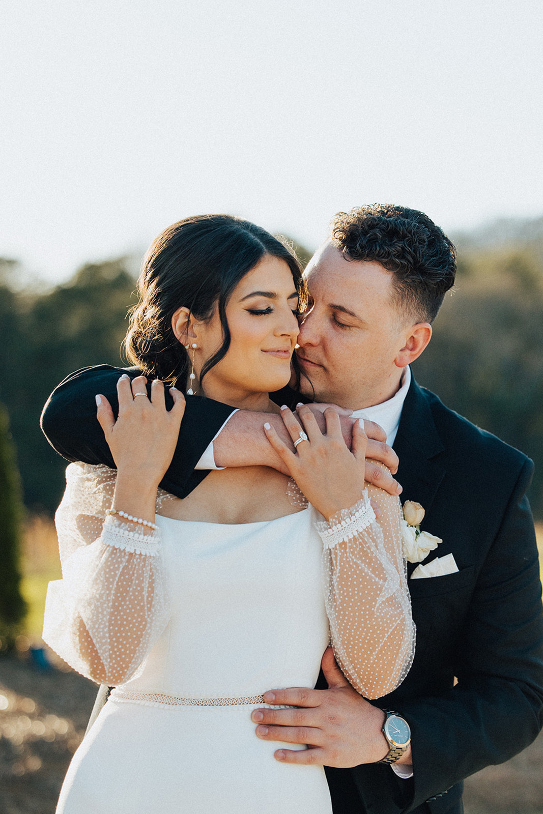 The groom embraces the bride for their Alabama wedding.