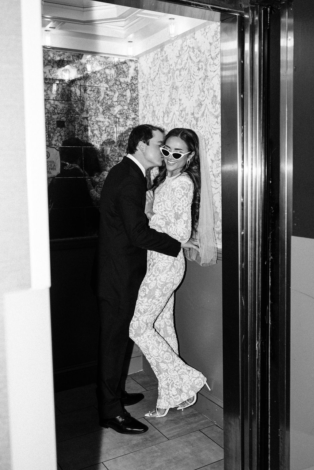 The couple kisses in an elevator in downtown Birmingham, Alabama.