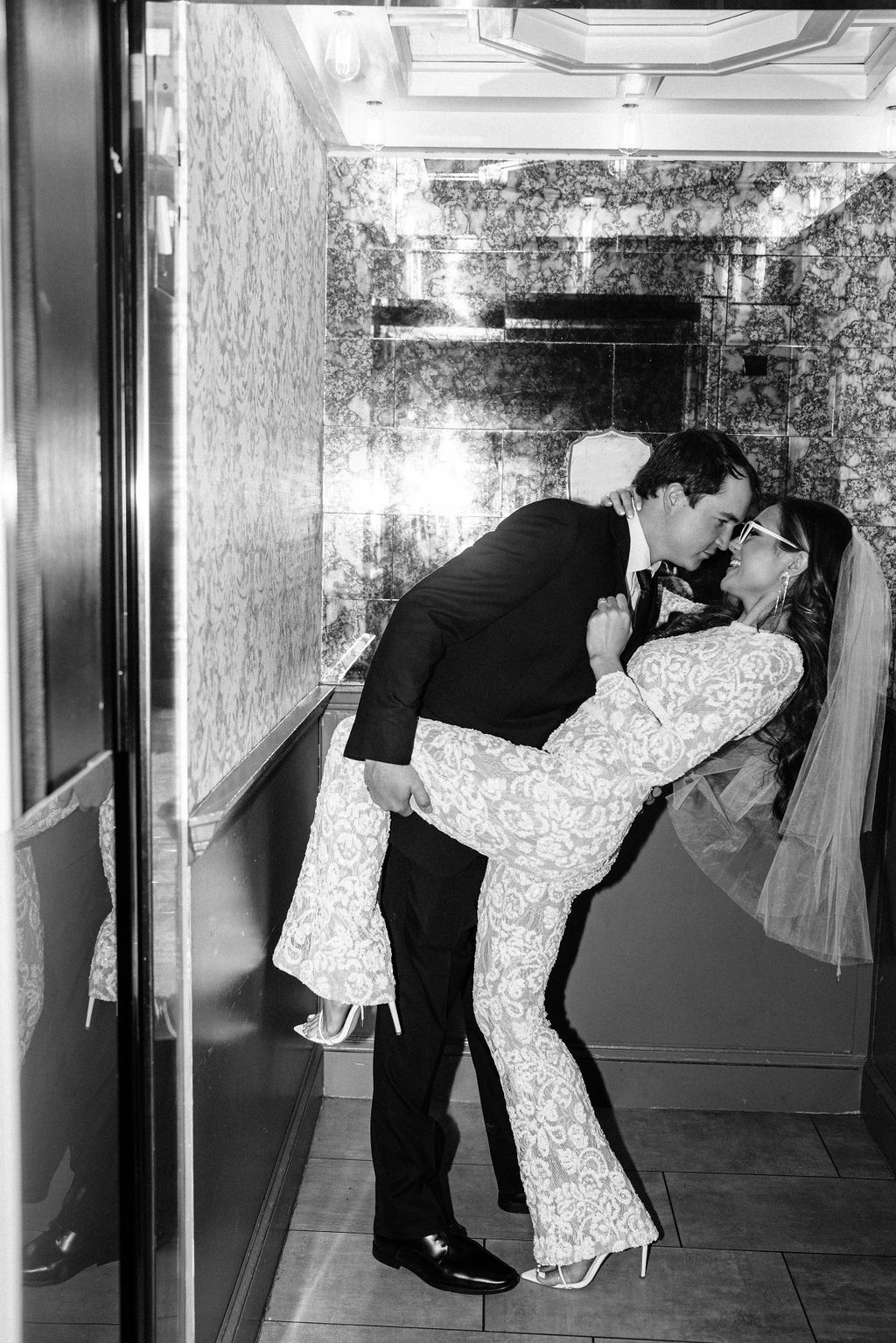 The couple shares a kiss in an elevator in downtown Birmingham, Alabama.