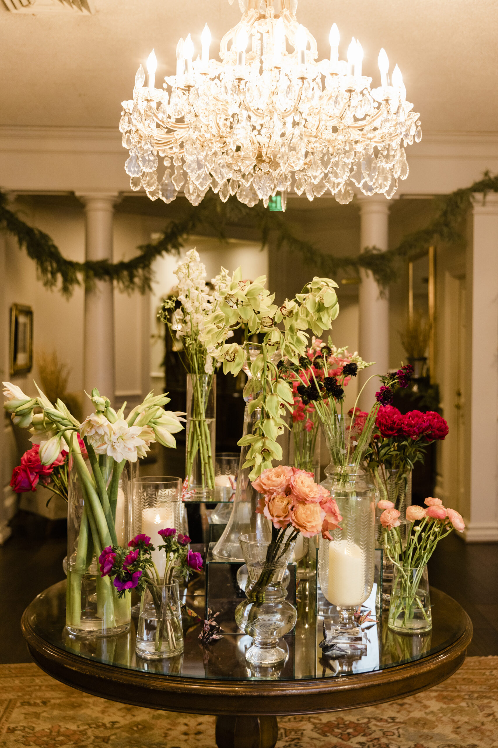 The entry table is set with flowers in vases.