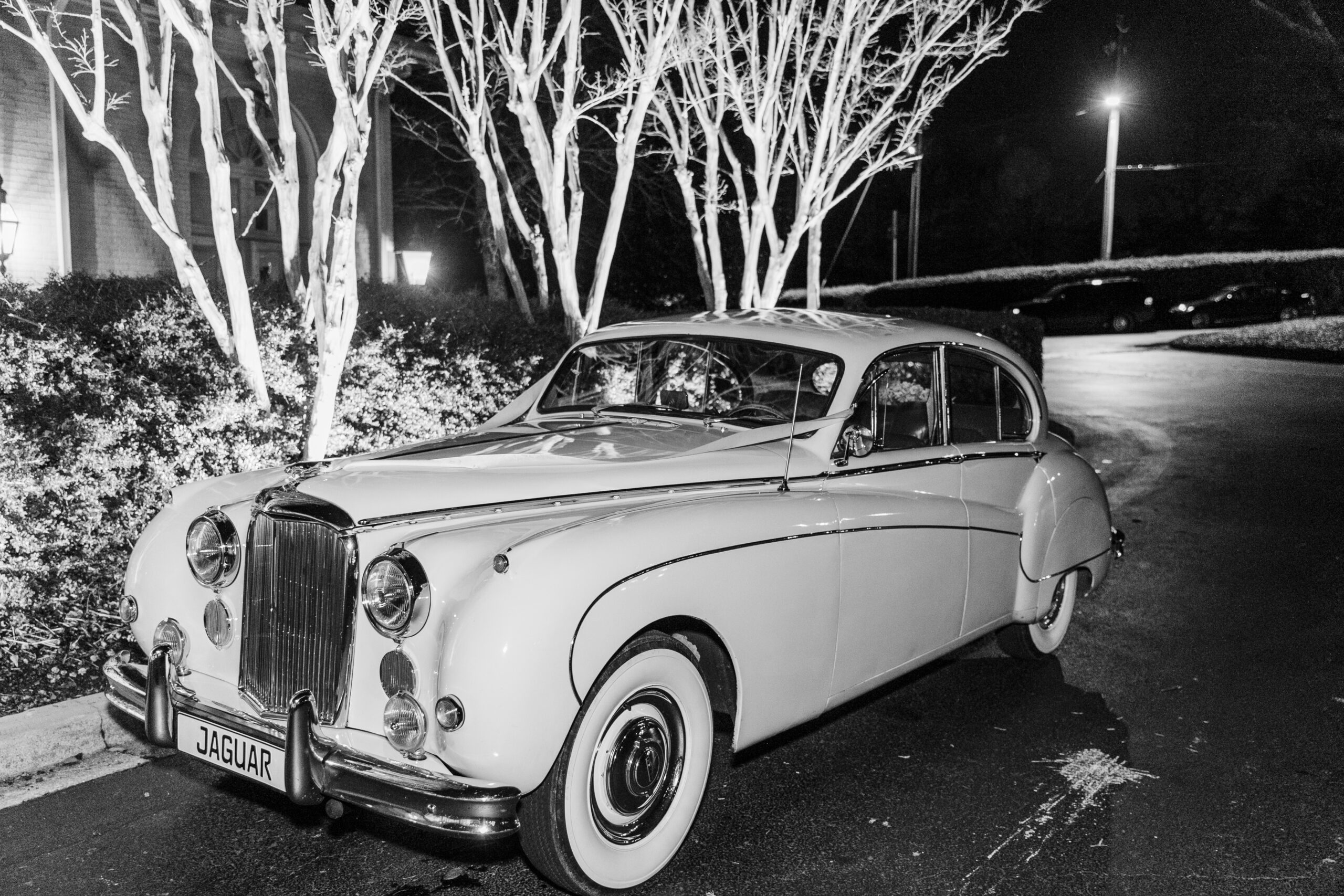 The vintage Jaguar from Coats Classic Car awaits the couple at the Birmingham wedding reception.